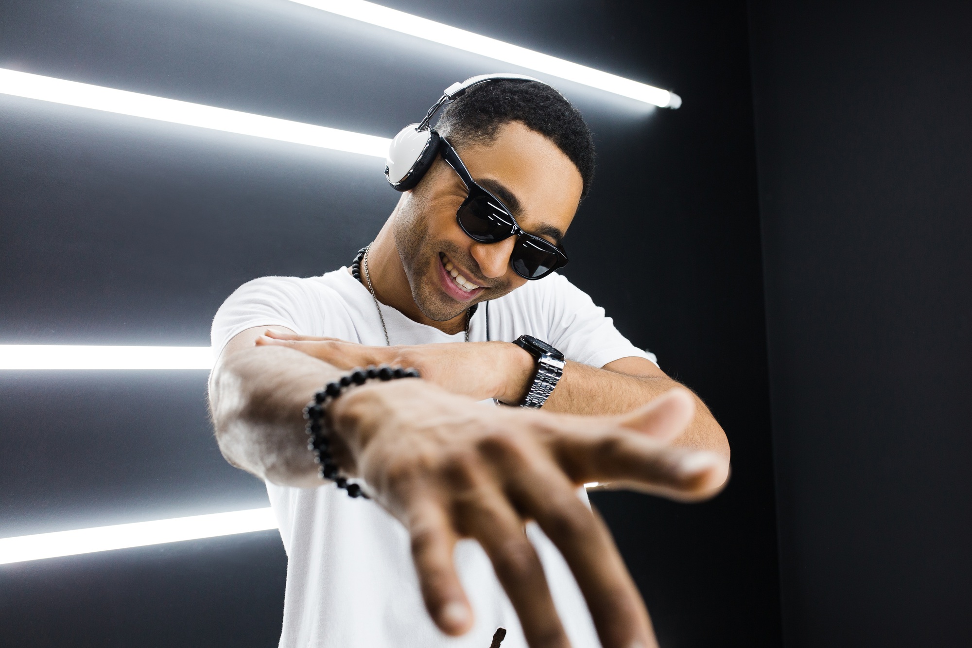 black man dancing in neon lights